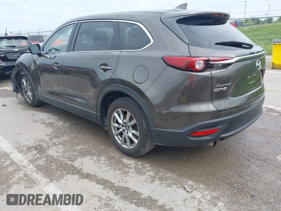 2017 Mazda CX-9 Touring z VIN JM3TCACY7H0129335, wystawiony jako IAAI lot #42289926 z przebiegiem 60 425 mil mil oraz . Historia ofert i sprzedaży dostępna na DreamBid. Obrazek 3.