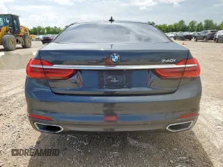 2016 BMW 7 Series 740i with VIN WBA7E2C57GG714564, listed as a Copart auction lot 64005965 with 111,598 mi miles and Salvage title. Bid and sale history available at DreamBid. Image 6.