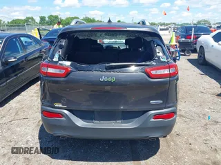 2014 Jeep Cherokee Latitude with VIN 1C4PJLCS0EW297415, listed as a IAAI auction lot 42198645 with 160,268 mi miles. Bid and sale history available at carsss.com. Image 16.
