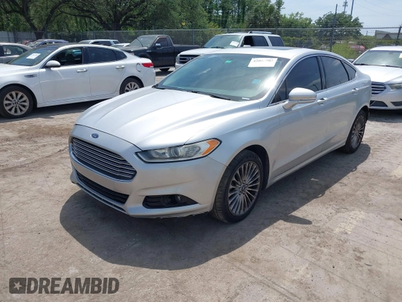 2014 Ford Fusion Titanium with VIN 3FA6P0K99ER358244, listed as a IAAI auction lot 42085703 with 194,626 mi miles. Bid and sale history available at carsss.com. Image 2.