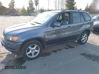 2003 BMW X5 3.0i with VIN 5UXFA53573LV83812, listed as a IAAI auction lot 41590046 with 166,841 mi miles. Bid and sale history available at carsss.com. Image 2.