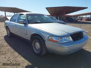 2003 Mercury Grand Marquis LS Premium with VIN 2MEFM75W33X650756, listed as a IAAI auction lot 41829977 with 130,879 mi miles. Bid and sale history available at carsss.com. Image 1.