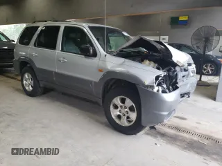 2001 Mazda Tribute LX with VIN 4F2CU08141KM65160, listed as a Copart auction lot 60895624 with 255,194 mi miles and Salvage Title. Bid and sale history available at carsss.com. Image 4.
