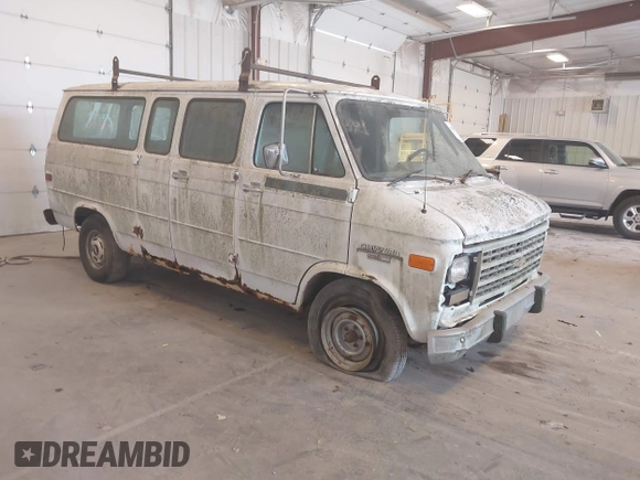 1992 Chevrolet Chevy Van z VIN 2GCEG25Z3N4144138, wystawiony jako IAAI lot #42389578 z przebiegiem 129 513 mil mil oraz . Historia ofert i sprzedaży dostępna na DreamBid. Obrazek 1.