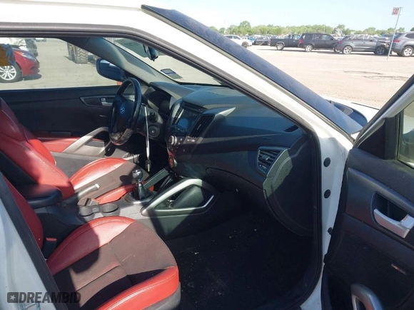 2015 Hyundai Veloster Turbo with VIN KMHTC6AE5FU228008, listed as a IAAI auction lot 42016707 with 122,507 mi miles. Bid and sale history available at carsss.com. Image 5.