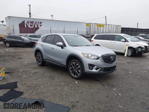 2016 Mazda CX-5 Grand Touring with VIN JM3KE4DY4G0712465, listed as a IAAI auction lot 41859217 with 61,806 mi miles and . Bid and sale history available at carsss.com. Image 1.