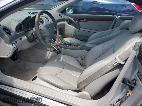 2005 Mercedes-Benz SL 500 with VIN WDBSK75F05F094991, listed as a Copart auction lot 61678705 with 128,123 mi miles and Clean title. Bid and sale history available at DreamBid. Image 7.