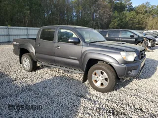 2015 Toyota Tacoma PreRunner with VIN 3TMJU4GN5FM180924, listed as a Copart auction lot 50864315 with 176,562 mi miles and Salvage title. Bid and sale history available at DreamBid. Image 4.