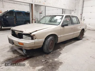 1991 Dodge Spirit z VIN 1B3XA46KXMF519542, wystawiony jako IAAI lot #42278204 z przebiegiem 134 919 mil mil oraz . Historia ofert i sprzedaży dostępna na DreamBid. Obrazek 2.