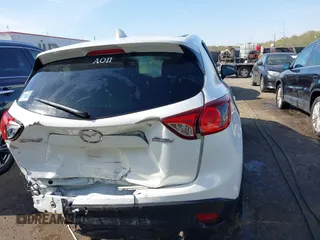 2014 Mazda CX-5 Touring with VIN JM3KE2CY5E0329783, listed as a IAAI auction lot 42017473 with 121,175 mi miles. Bid and sale history available at carsss.com. Image 16.
