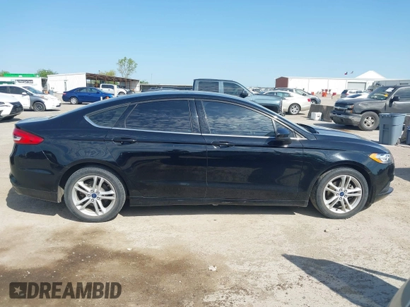 2018 Ford Fusion SE z VIN 3FA6P0H74JR125761, wystawiony jako IAAI lot #41992708 z przebiegiem 102 242 mil mil oraz . Historia ofert i sprzedaży dostępna na DreamBid. Obrazek 13.