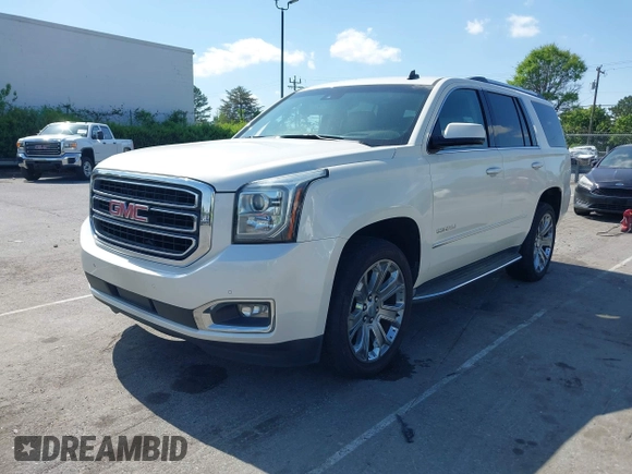 2015 GMC Yukon Denali with VIN 1GKS1CKJ3FR230797, listed as a IAAI auction lot 41977294 with 174,633 mi miles. Bid and sale history available at carsss.com. Image 2.