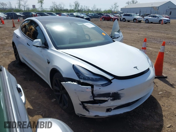 2020 Tesla Model 3 Standard Range Plus with VIN 5YJ3E1EA3LF785951, listed as a IAAI auction lot 41919339 with 63,025 mi miles and . Bid and sale history available at carsss.com. Image 1.