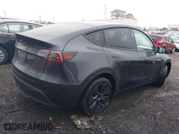2025 Tesla Model Y Long Range with VIN 7SAYGDED0SA357488, listed as a IAAI auction lot 41550514 with 6 mi miles and . Bid and sale history available at DreamBid. Image 4.