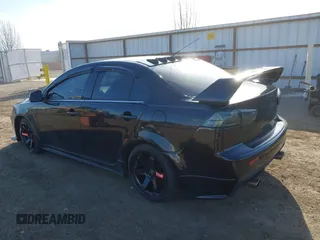 2009 Mitsubishi Lancer with VIN JA3AV66V39U040203, listed as a IAAI auction lot 41884811 with 117,429 mi miles and . Bid and sale history available at DreamBid. Image 3.