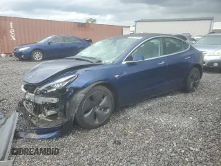 2019 Tesla Model 3 Mid Range z VIN 5YJ3E1EA5KF411789, wystawiony jako Copart lot #56937495 z przebiegiem 77 633 mil mil oraz Szkoda całkowita • Salvage title. Historia ofert i sprzedaży dostępna na DreamBid. Obrazek 1.
