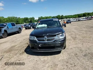 2013 Dodge Journey SE with VIN 3C4PDCAB5DT729415, listed as a Copart auction lot 55851915 with 128,782 mi miles and Salvage title. Bid and sale history available at DreamBid. Image 14.