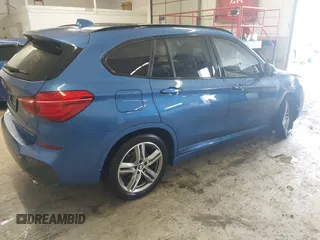 2019 BMW X1 xDrive28i with VIN WBXHT3C53K5L36690, listed as a IAAI auction lot 42012992 with 70,339 mi miles. Bid and sale history available at carsss.com. Image 4.