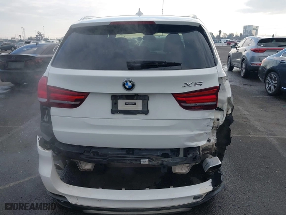 2018 BMW X5 xDrive40e iPerformance with VIN 5UXKT0C58J0V99415, listed as a IAAI auction lot 41391474 with 124,671 mi miles. Bid and sale history available at carsss.com. Image 17.