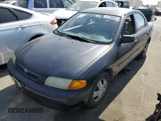 1997 Mazda Protege DX with VIN JM1BC1412V0157268, listed as a Copart auction lot 61380564 with 85,356 mi miles and Salvage Title. Bid and sale history available at DreamBid. Image 1.