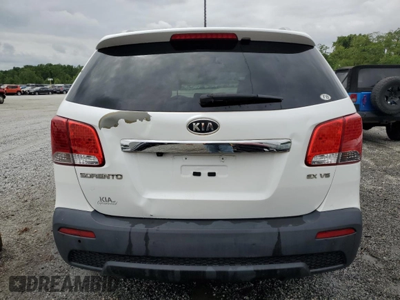 2012 Kia Sorento EX z VIN 5XYKU4A20CG301970, wystawiony jako Copart lot #54360795 z przebiegiem 208 616 mil mil oraz Szkoda całkowita • Salvage title. Historia ofert i sprzedaży dostępna na DreamBid. Obrazek 6.