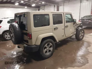 2018 Jeep Wrangler JK Unlimited Sahara with VIN 1C4HJWEG4JL803516, listed as a IAAI auction lot 41127652 with 85,749 mi miles. Bid and sale history available at carsss.com. Image 4.