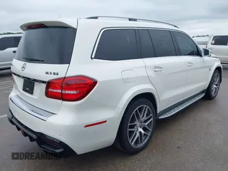 2018 Mercedes-Benz GLS 63 AMG with VIN 4JGDF7FE1JB099084, listed as a IAAI auction lot 42220385 with 97,904 mi miles and . Bid and sale history available at DreamBid. Image 4.