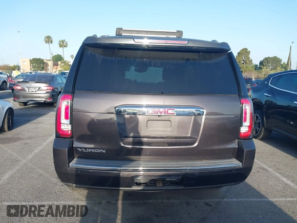 2015 GMC Yukon Denali z VIN 1GKS1CKJ7FR566419, wystawiony jako IAAI lot #41948825 z przebiegiem 235 037 mil mil oraz . Historia ofert i sprzedaży dostępna na DreamBid. Obrazek 16.