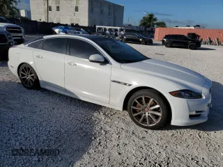 2018 Jaguar XJ with VIN SAJWA1C77J8W14750, listed as a Copart auction lot 87273204 with 51,040 mi miles and Clean Title. Bid and sale history available at carsss.com. Image 4.