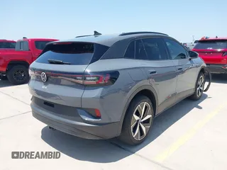 2023 Volkswagen ID.4 Pro S z VIN 1V2GNPE80PC006590, wystawiony jako IAAI lot #42178241 z przebiegiem 17 177 mil mil oraz . Historia ofert i sprzedaży dostępna na DreamBid. Obrazek 4.