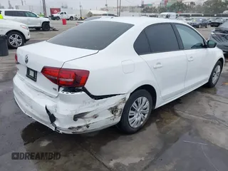 2016 Volkswagen Jetta Sedan 1.4T S w/Technology with VIN 3VW267AJ6GM237619, listed as a IAAI auction lot 41878297 with 124,887 mi miles. Bid and sale history available at carsss.com. Image 4.