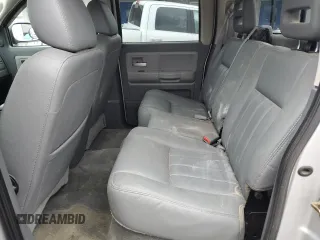 2005 Dodge Dakota Laramie z VIN 1D7HW58N95S200293, wystawiony jako Copart lot #56053075 z przebiegiem 104 769 mil mil oraz Szkody całkowita. Historia ofert i sprzedaży dostępna na DreamBid. Obrazek 10.