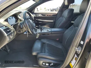 2018 BMW 7 Series 740i with VIN WBA7E2C59JG742809, listed as a Copart auction lot 66995934 with 62,017 mi miles and Salvage Title. Bid and sale history available at carsss.com. Image 7.