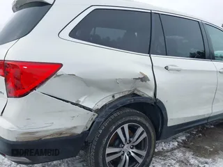 2017 Honda Pilot EX-L with VIN 5FNYF6H52HB015651, listed as a IAAI auction lot 41538814 with 121,433 mi miles and . Bid and sale history available at DreamBid. Image 6.