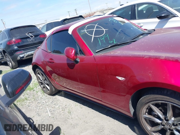2021 Mazda MX-5 Miata Grand Touring с VIN JM1NDAM71M0459437, выставлен на аукционе IAAI как лот 41808704 с пробегом 19 368 миль миль и . История ставок и продаж доступна на DreamBid. Изображение 14.