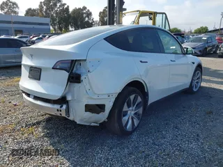 2024 Tesla Model Y with VIN 7SAYGDED2RF017448, listed as a IAAI auction lot 41597056 with 9,702 mi miles and . Bid and sale history available at DreamBid. Image 4.