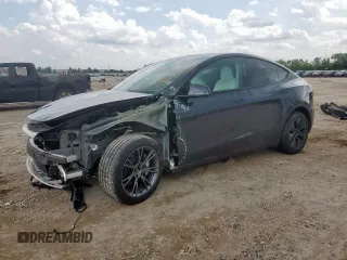 2024 Tesla Model Y Long Range z VIN 7SAYGDEE2RA308165, wystawiony jako Copart lot #59743935 z przebiegiem 8 876 mil mil oraz Szkoda całkowita • Salvage title. Historia ofert i sprzedaży dostępna na DreamBid. Obrazek 1.