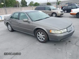1999 Cadillac Seville Luxury SLS z VIN 1G6KS54Y1XU904431, wystawiony jako IAAI lot #42454866 z przebiegiem 160 946 mil mil oraz . Historia ofert i sprzedaży dostępna na DreamBid. Obrazek 1.