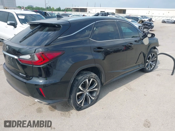 2018 Lexus RX 350 with VIN 2T2ZZMCA1JC103035, listed as a IAAI auction lot 42241695 with 104,382 mi miles and . Bid and sale history available at DreamBid. Image 4.