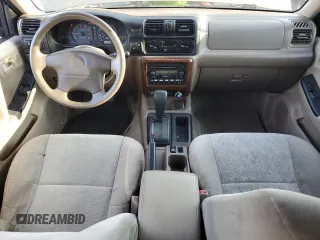 2001 Isuzu Rodeo S with VIN 4S2CK58W314334096, listed as a Copart auction lot 68262924 with 140,657 mi miles and Salvage Title. Bid and sale history available at DreamBid. Image 8.