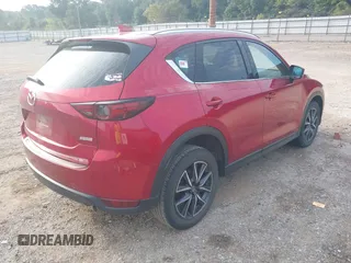 2017 Mazda CX-5 Grand Touring with VIN JM3KFADL8H0189033, listed as a IAAI auction lot 40029931 with 88,933 mi miles and . Bid and sale history available at carsss.com. Image 4.