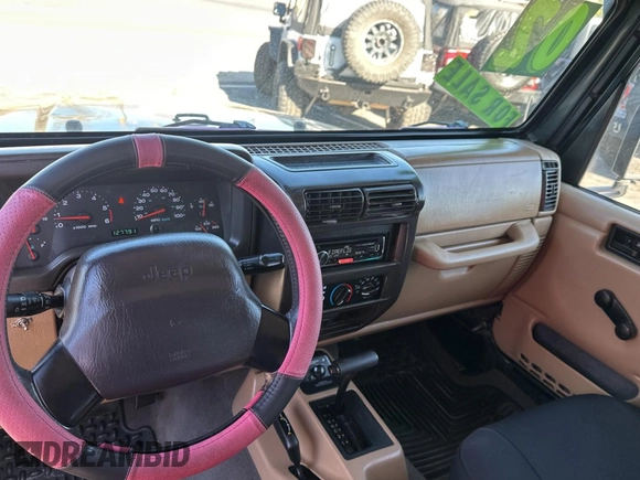 2002 Jeep Wrangler Sport with VIN 1J4FA49S32P765579, listed as a Copart auction lot 55244845 with 127,791 mi miles and Clean Title. Bid and sale history available at carsss.com. Image 9.