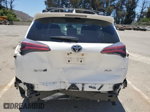 2018 Toyota RAV4 XLE with VIN JTMWFREV1JD122524, listed as a Copart auction lot 63707745 with 51,003 mi miles and Salvage title. Bid and sale history available at DreamBid. Image 6.