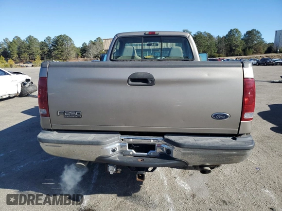 2002 Ford F-250 XL with VIN 1FTNF21L02EA83007, listed as a Copart auction lot 87880345 with 104,889 mi miles and Salvage title. Bid and sale history available at DreamBid. Image 6.