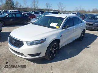 2014 Ford Taurus SEL z VIN 1FAHP2E81EG104137, wystawiony jako IAAI lot #42054432 z przebiegiem 146 046 mil mil oraz . Historia ofert i sprzedaży dostępna na DreamBid. Obrazek 2.