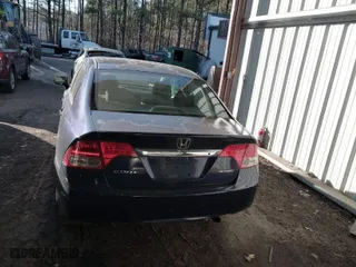 2009 Honda Civic Sdn LX with VIN 2HGFA16559H544472, listed as a IAAI auction lot 41695513 with 124,845 mi miles. Bid and sale history available at carsss.com. Image 16.