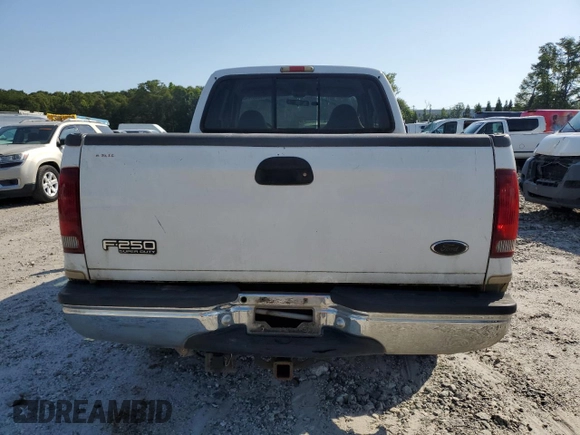 2000 Ford F-250 XL with VIN 1FTNX21F3YEB32295, listed as a Copart auction lot 60867745 with 329,194 mi miles and Salvage title. Bid and sale history available at DreamBid. Image 6.