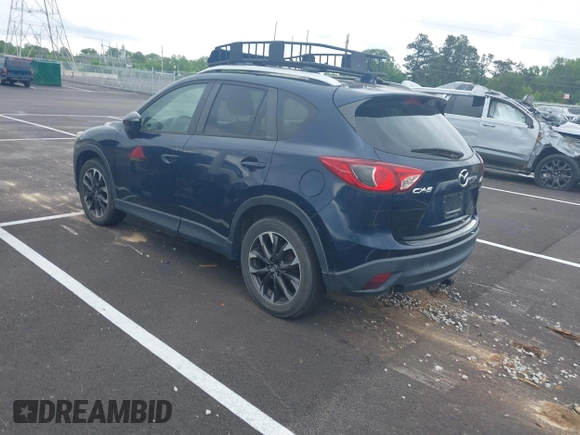 2016 Mazda CX-5 Grand Touring with VIN JM3KE2DYXG0890174, listed as a IAAI auction lot 42157884 with 141,873 mi miles. Bid and sale history available at carsss.com. Image 3.