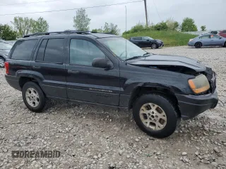 2000 Jeep Grand Cherokee Laredo z VIN 1J4GW48S1YC326453, wystawiony jako Copart lot #57332675 z przebiegiem 290 059 mil mil oraz Czysty tytuł • Clean title. Historia ofert i sprzedaży dostępna na DreamBid. Obrazek 4.