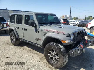 2019 Jeep Wrangler Unlimited Rubicon with VIN 1C4HJXFN1KW502477, listed as a Copart auction lot 52441455 with 53,110 mi miles and Salvage title. Bid and sale history available at DreamBid. Image 4.